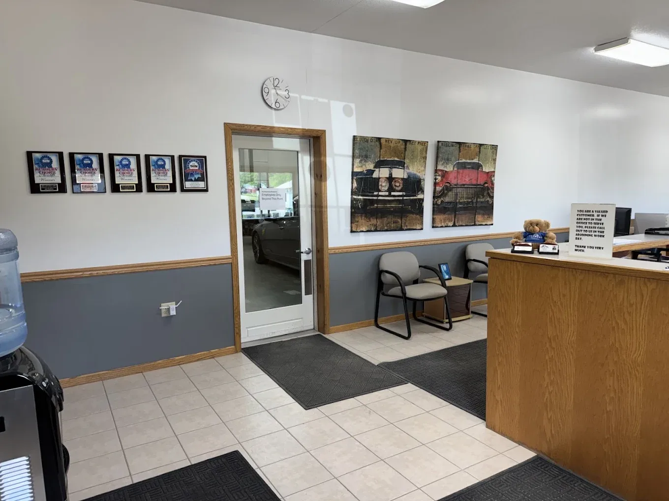 The Bodywerks front lobby with five Readers' Choice award plaques on the wall